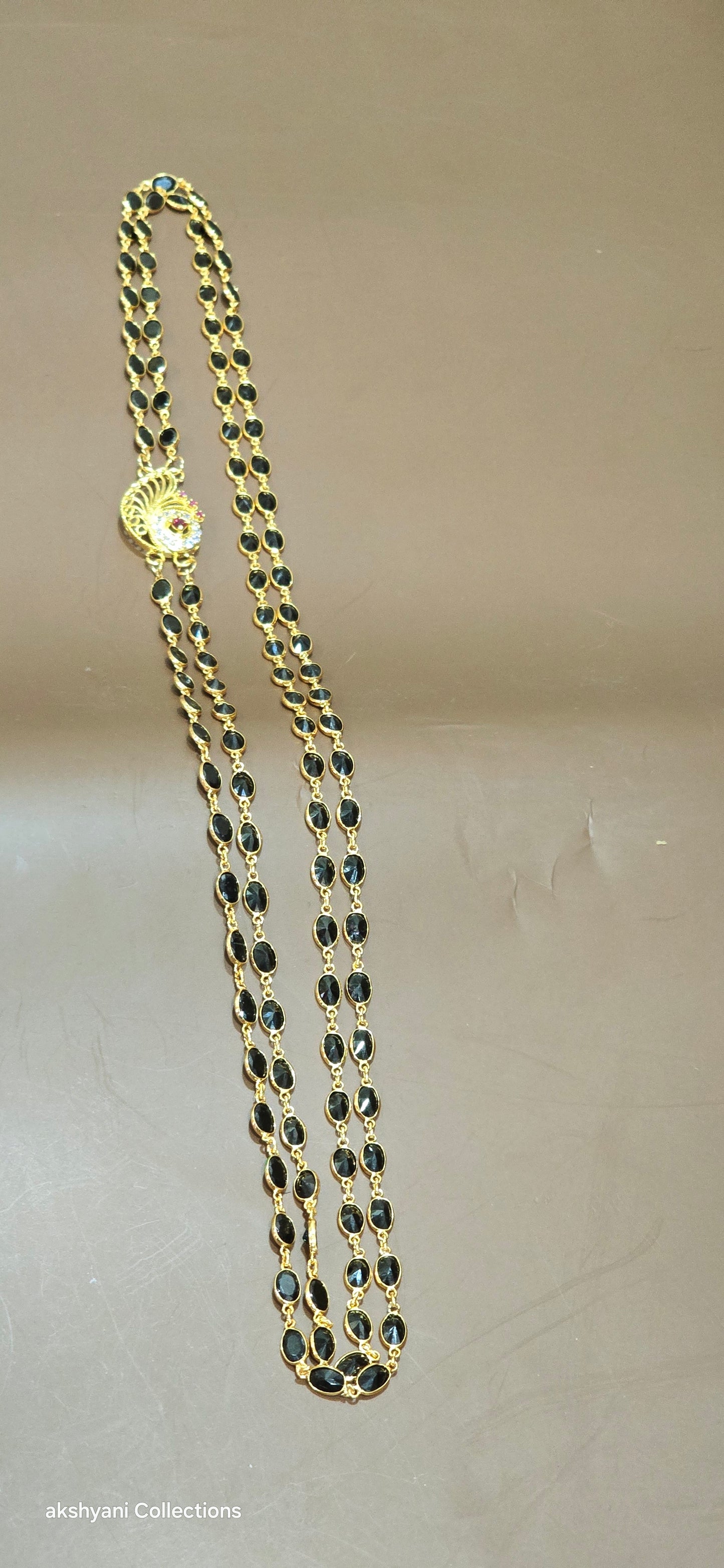 2 layer function wear faucet black beads with side brooch.