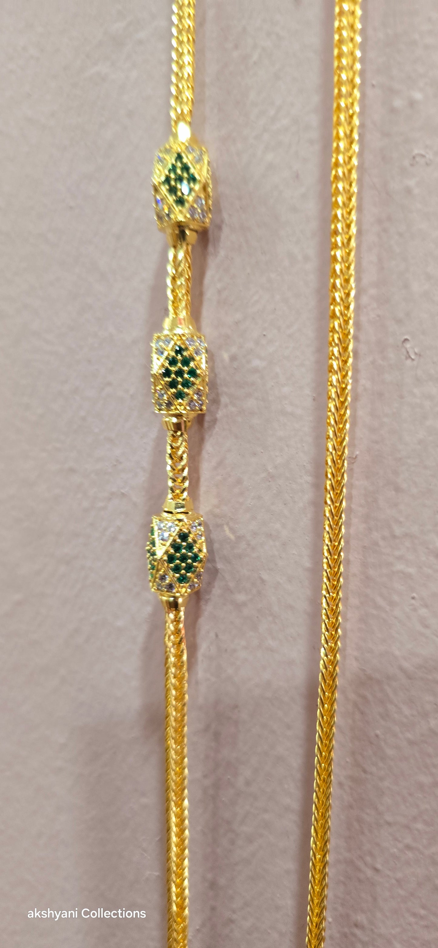 Function wear thalikodi with 3 inches extension. Green octagon shape brooch with mossanite stones embedded with brilliance