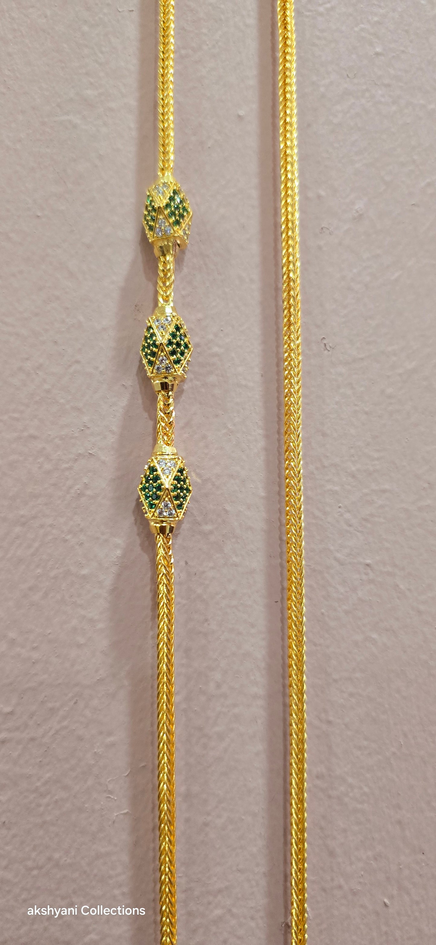 Function wear thalikodi with 3 inches extension. Green octagon shape brooch with mossanite stones embedded with brilliance