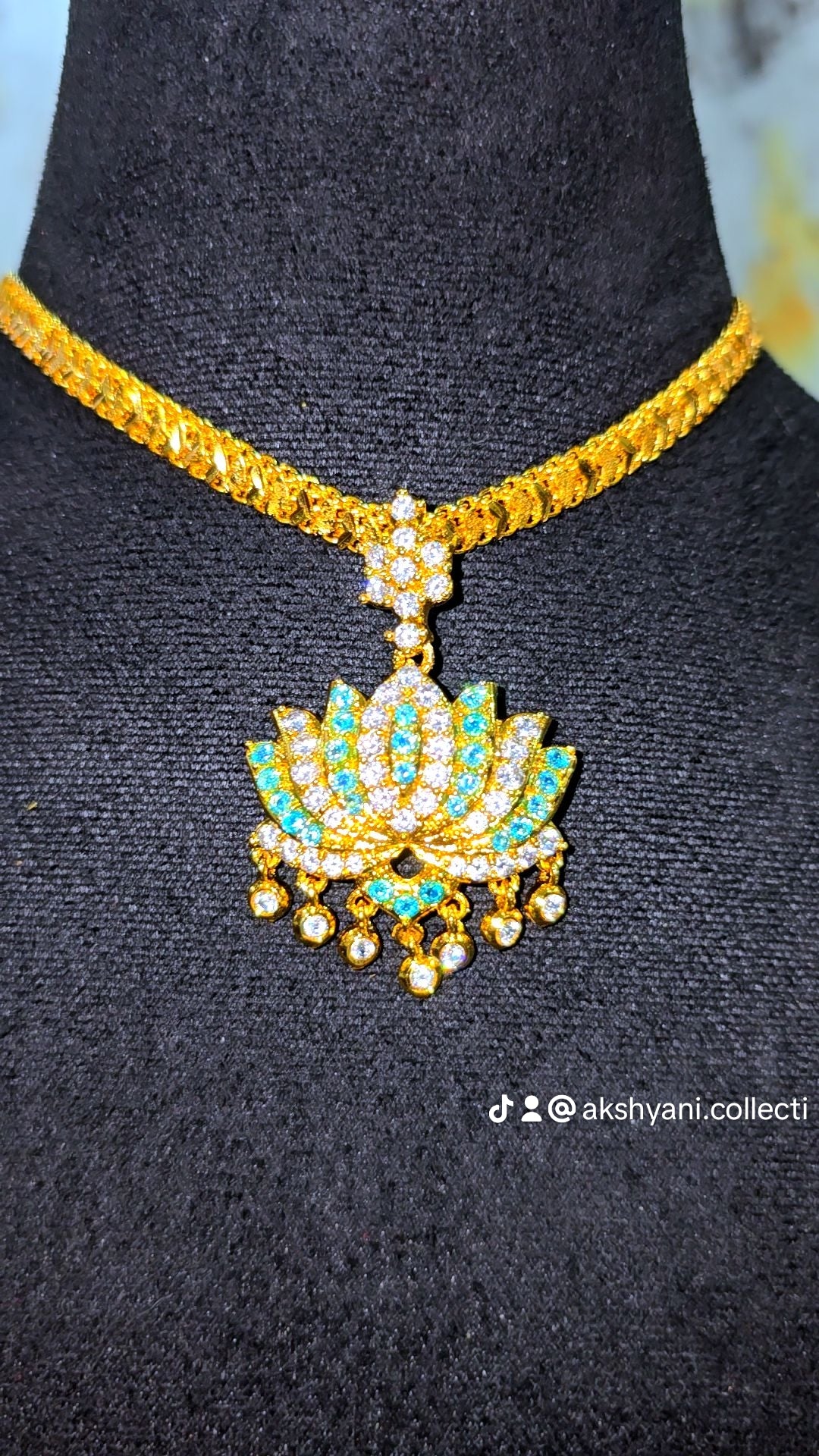 Aqua blue and white stones aatil with diamontele chain .Not 916 gold. Code 9097