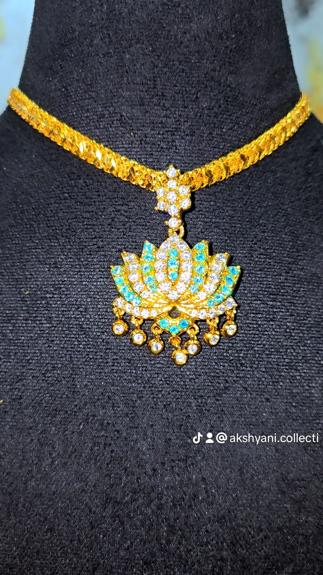 Aqua blue and white stones aatil with diamontele chain .Not 916 gold. Code 9097