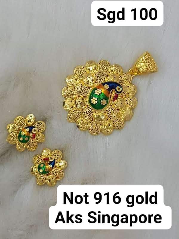 Peacock locket with earrings not 916 gold