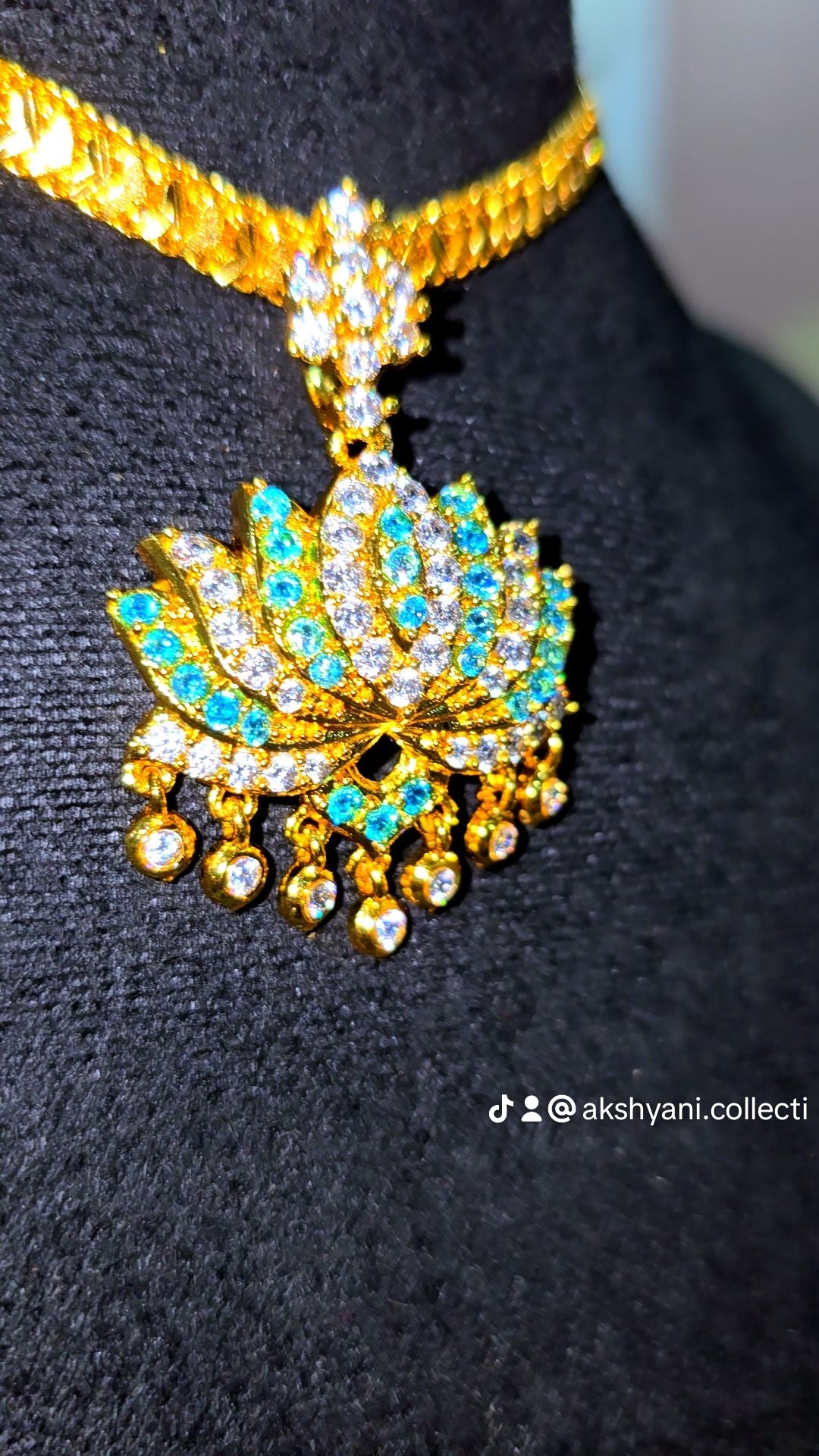 Aqua blue and white stones aatil with diamontele chain .Not 916 gold. Code 9097