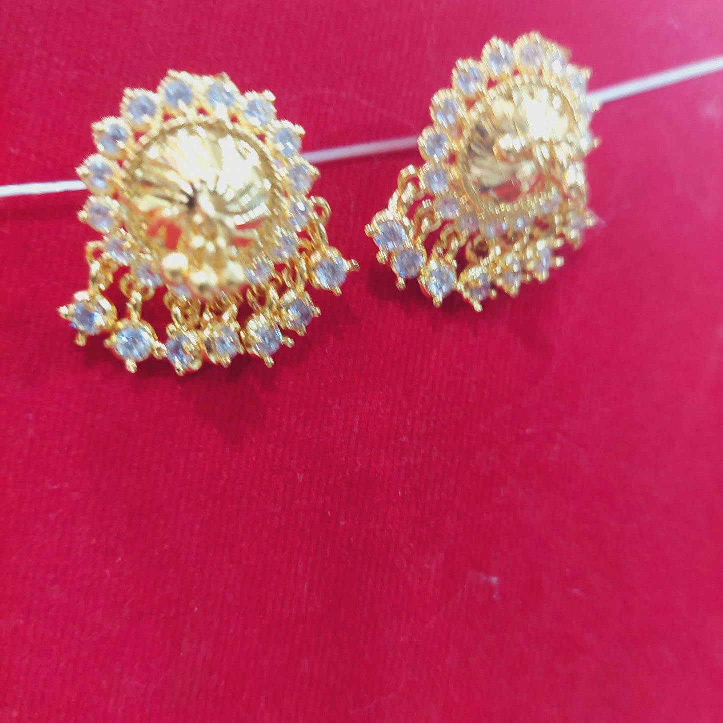 mossanite white stones thiruvilaiyadal earrings. Not 916. 20 cents coin circumference