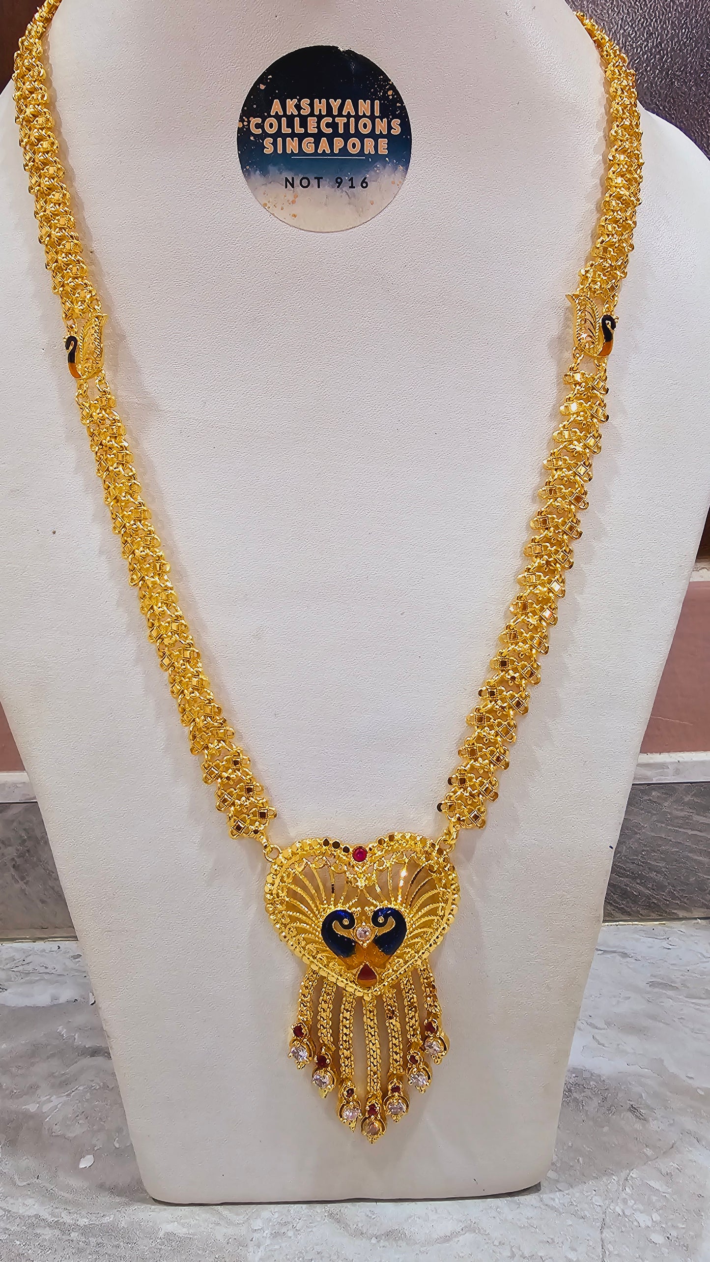 Peacock maalai code 804Y. 28 inches in length.  Not 916 gold