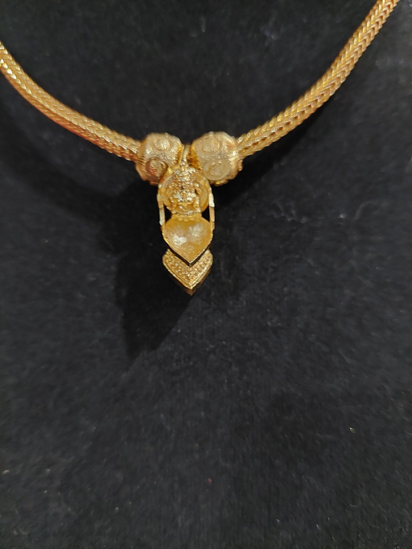 Not 916 gold. Mahalakshimi vilaku pendent with chain. Function wear type of jewellery