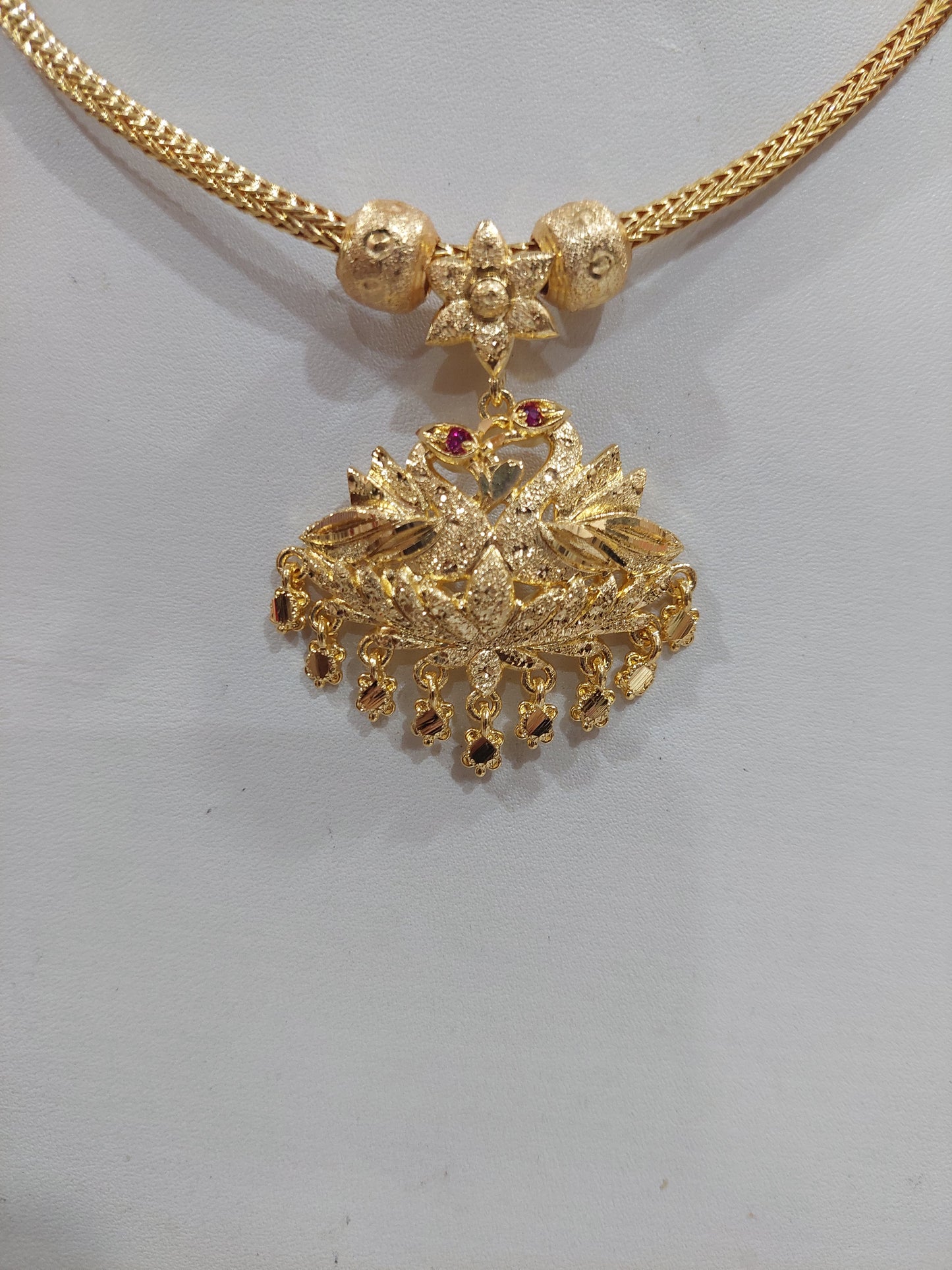 Peacock full gold aatil with chain. Not 916 gold. Function wear type of jewellery. Removable pendent.