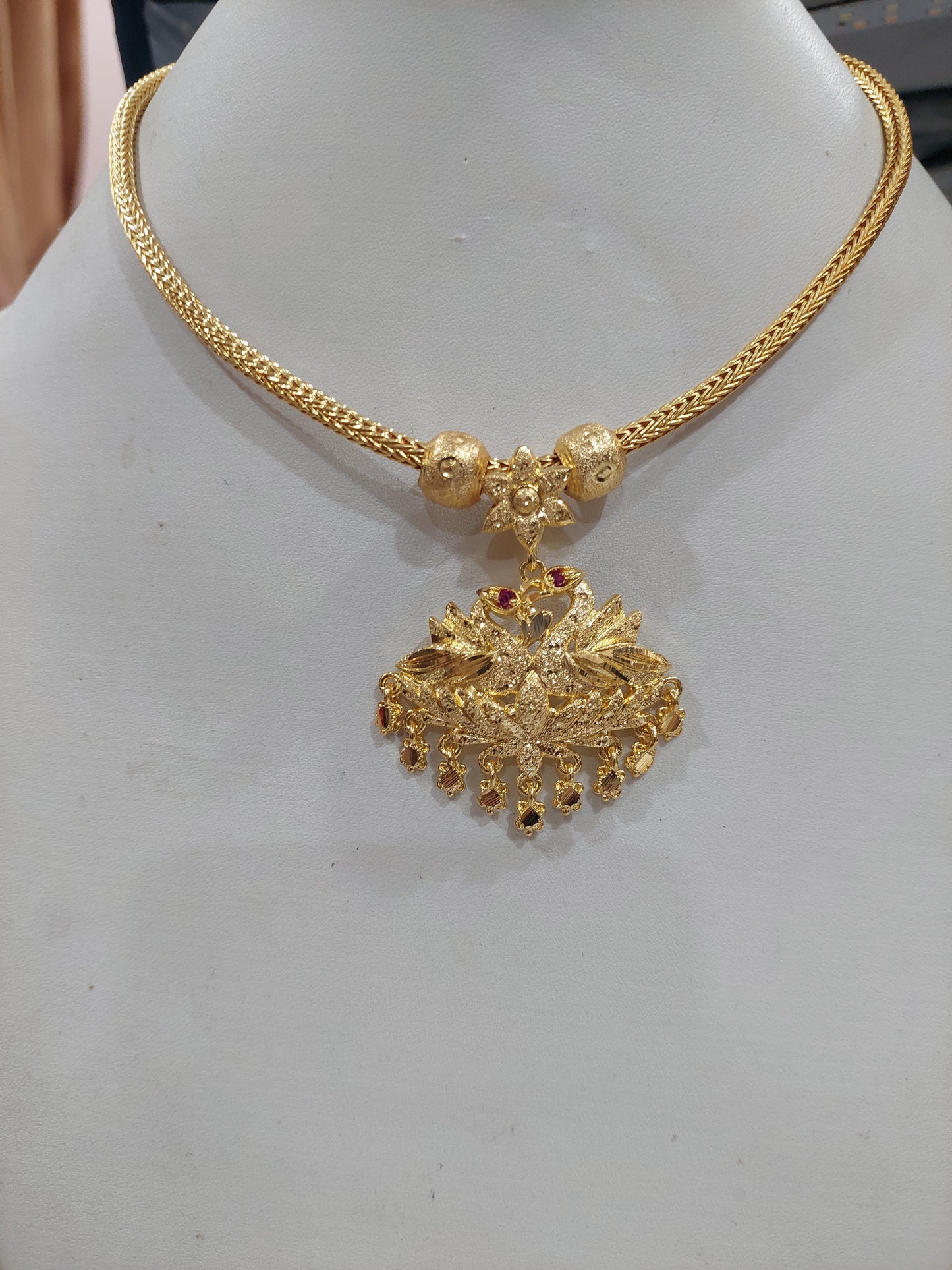 Peacock full gold aatil with chain. Not 916 gold. Function wear type of jewellery. Removable pendent.