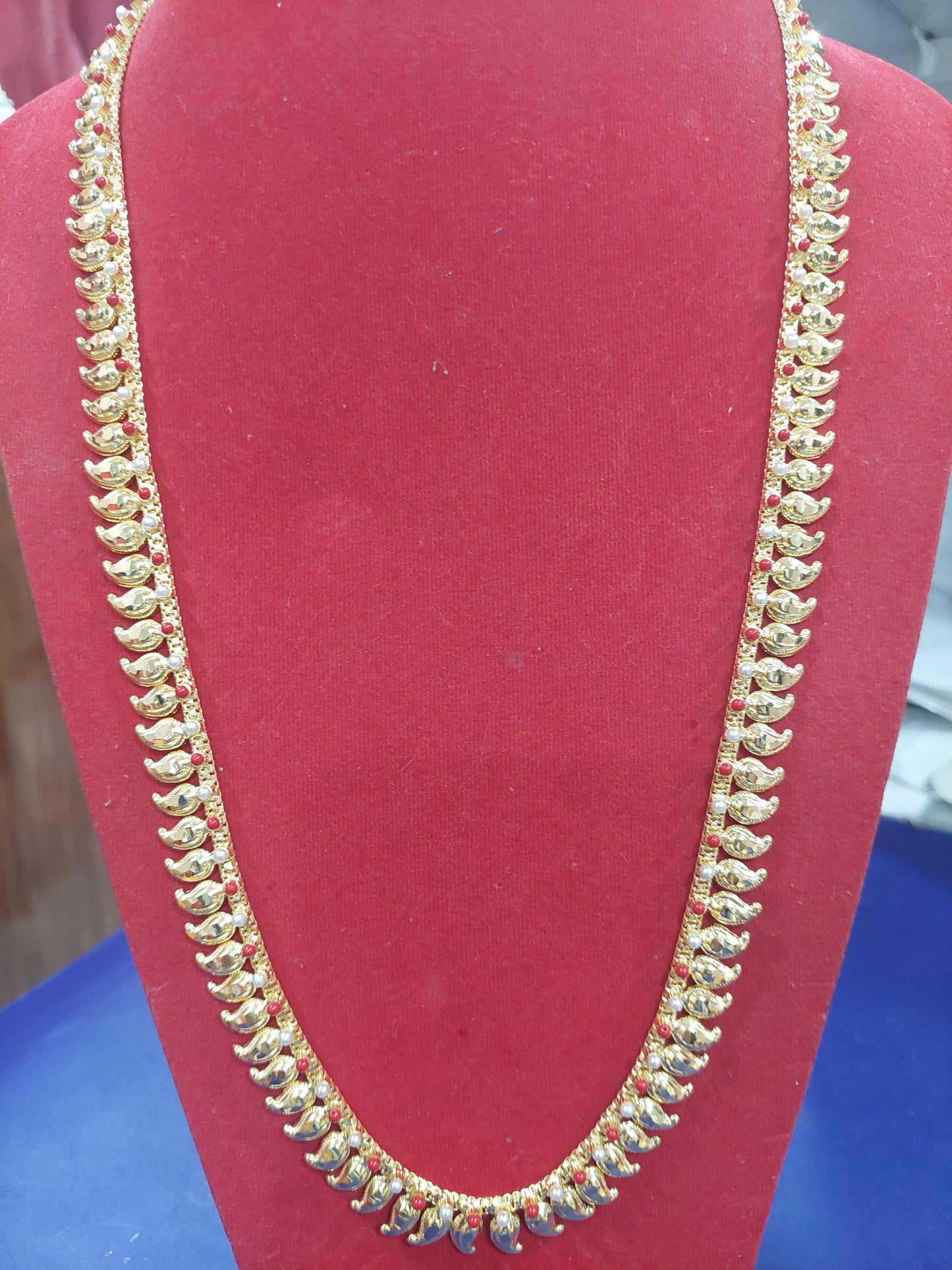 Mango chain not 916 gold. Coral and pearl.