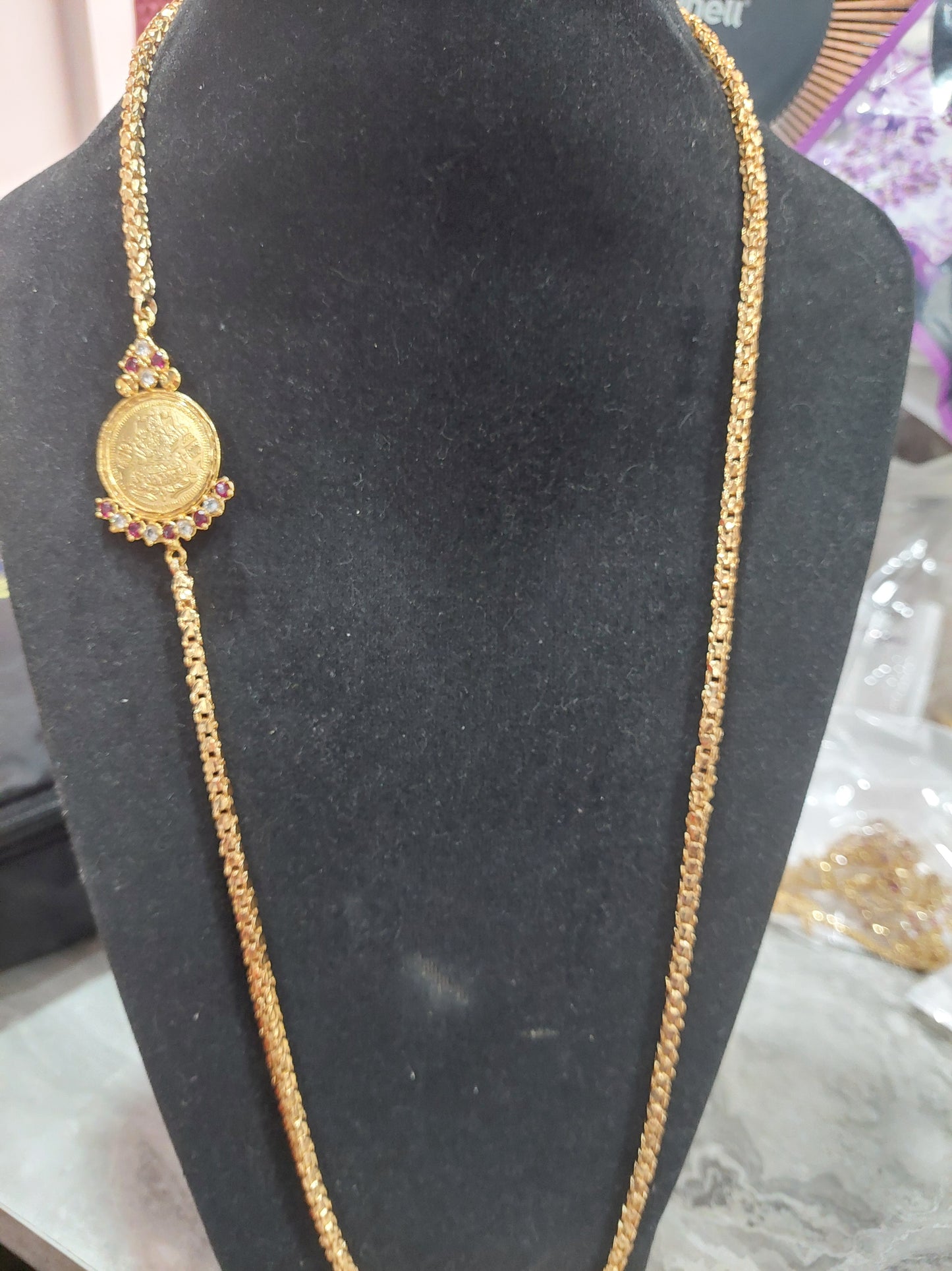 Mahalakshimi mugappu chain. Not 916 gold. Length 30 inches. Function wear type of jewellery