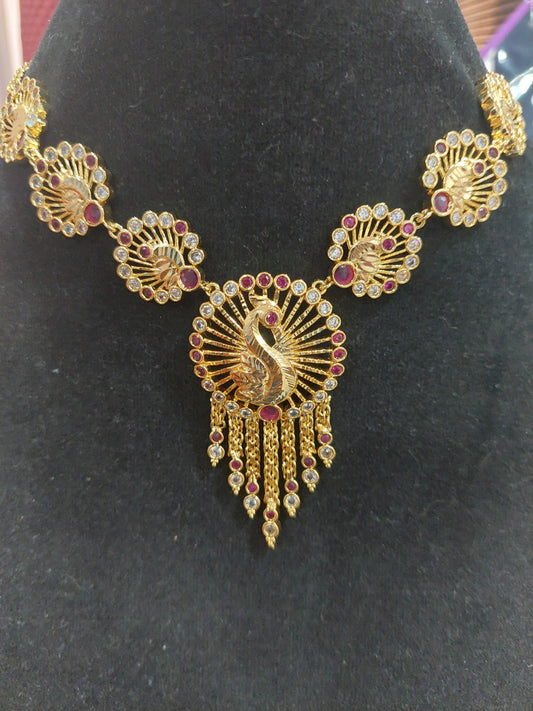 Micron plating peacock necklace with rings behind to adjust. Not 916 gold.