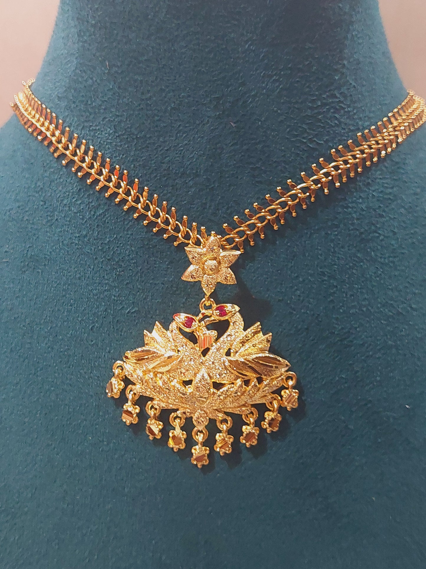 Aatil chain with removable peacock locket. Not 916 gold