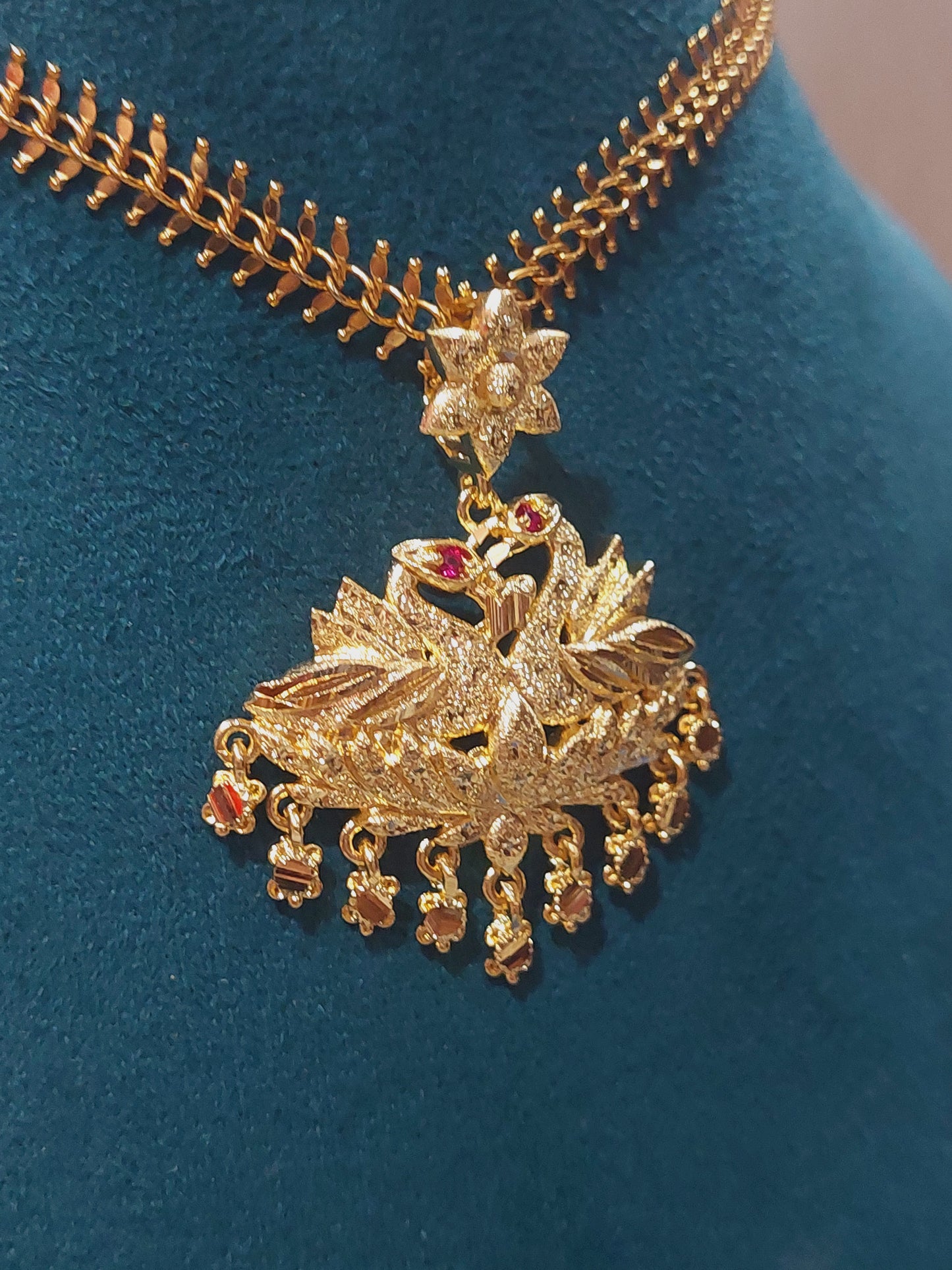 Aatil chain with removable peacock locket. Not 916 gold