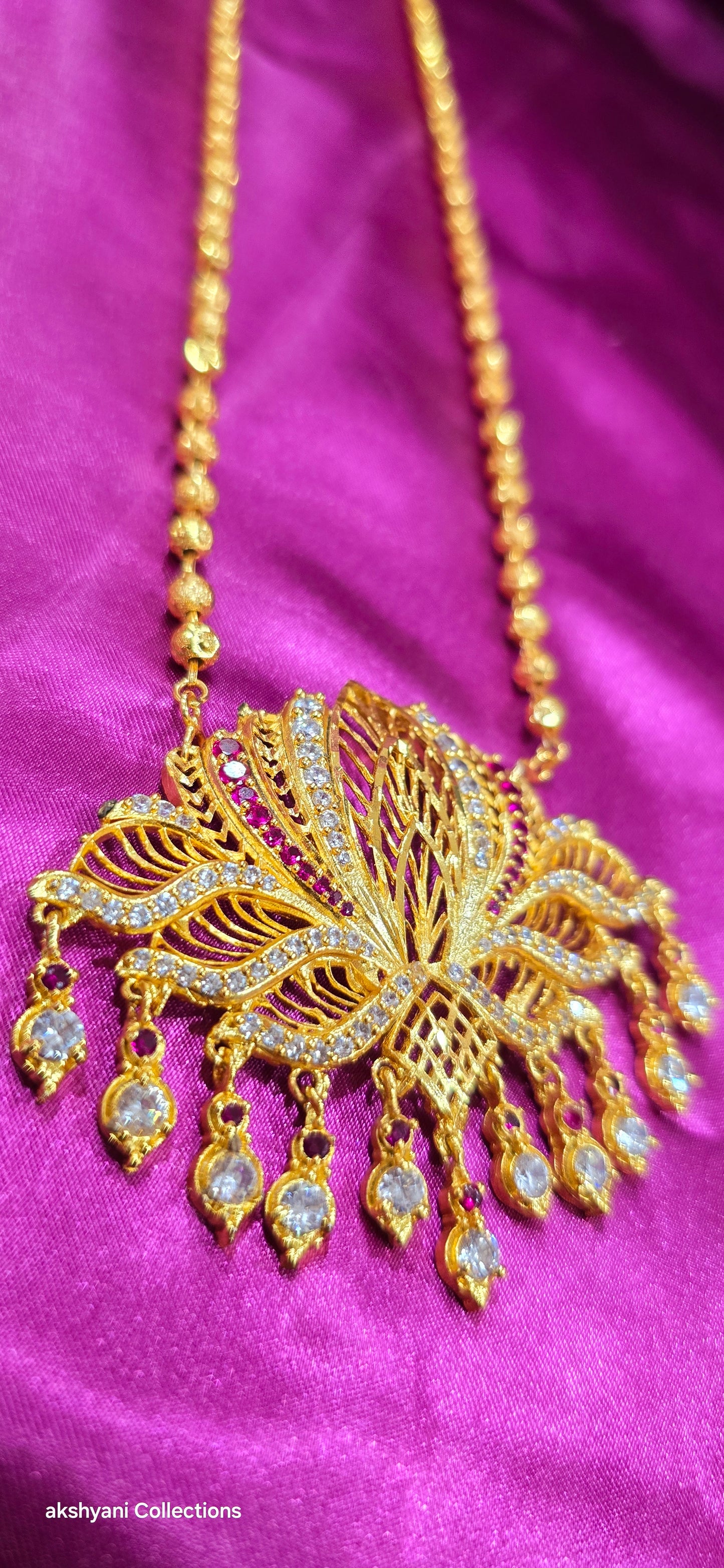 1 layer lotus maalai not 916 gold. 32 inches together with pendent chain