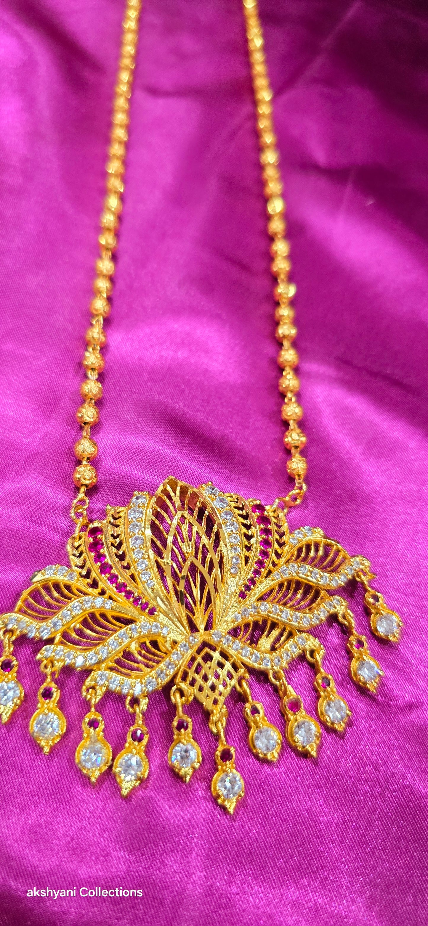 1 layer lotus maalai not 916 gold. 32 inches together with pendent chain