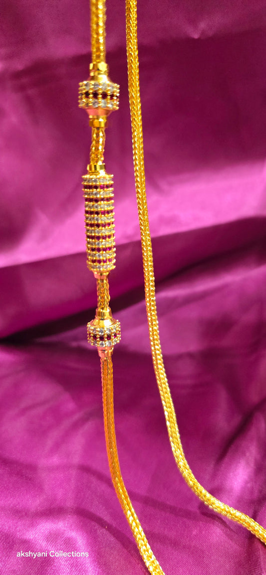 Ruby red Functionwear type thalikodi.  Not 916 gold