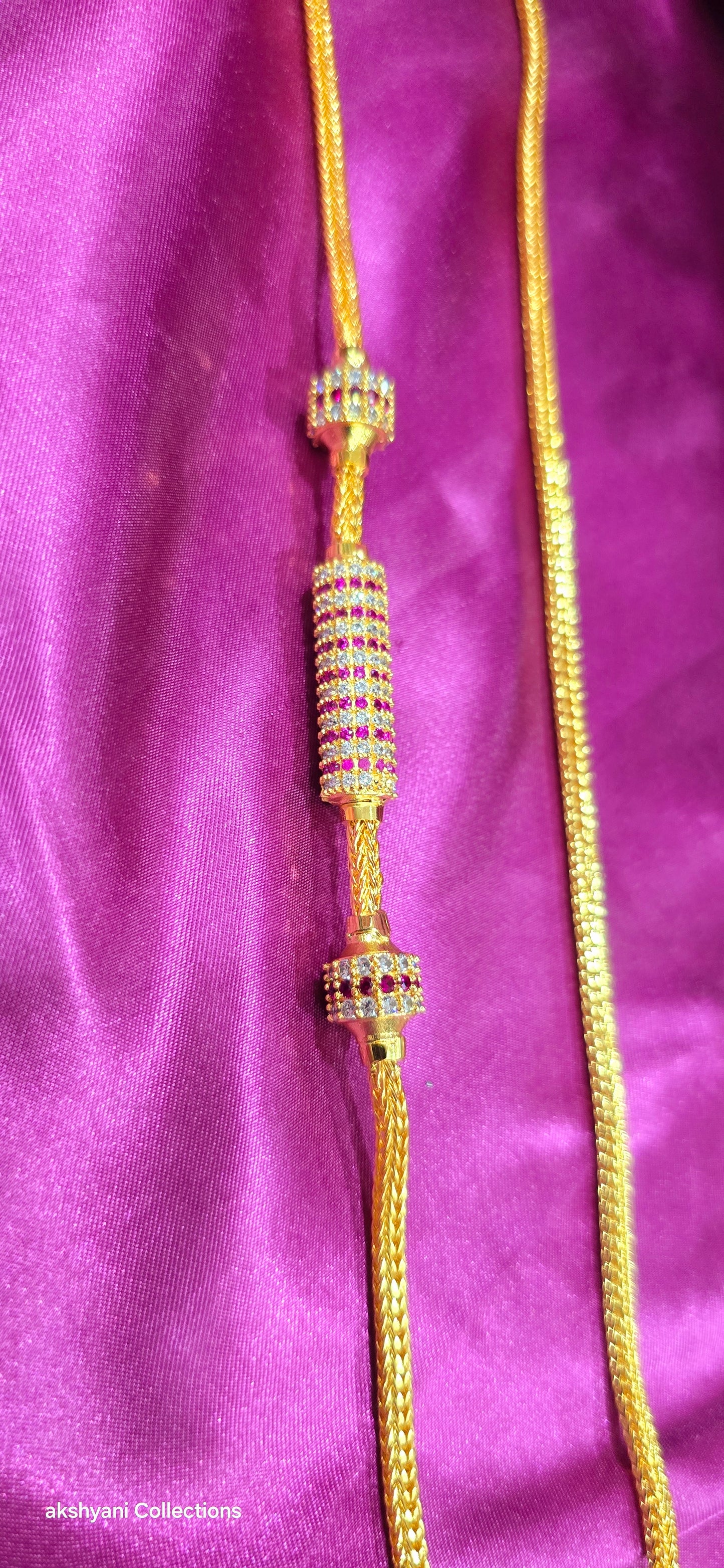 Ruby red Functionwear type thalikodi.  Not 916 gold