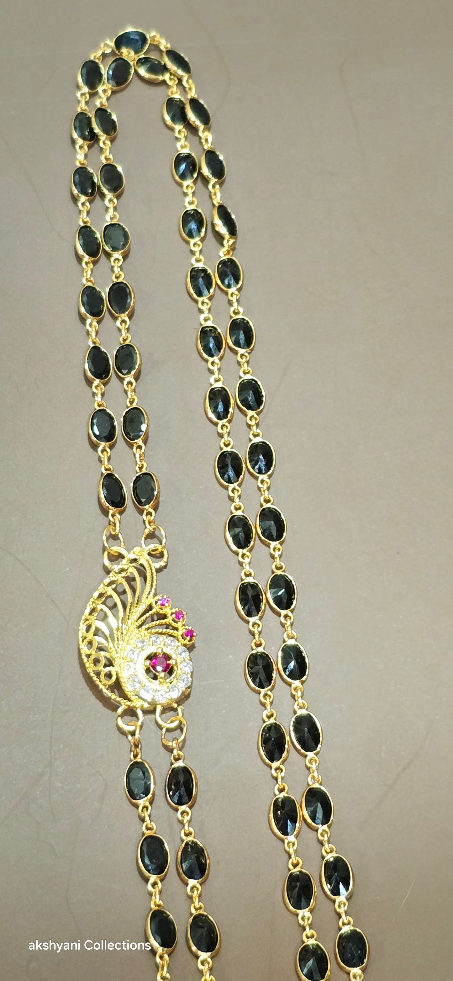 2 layer function wear faucet black beads with side brooch.