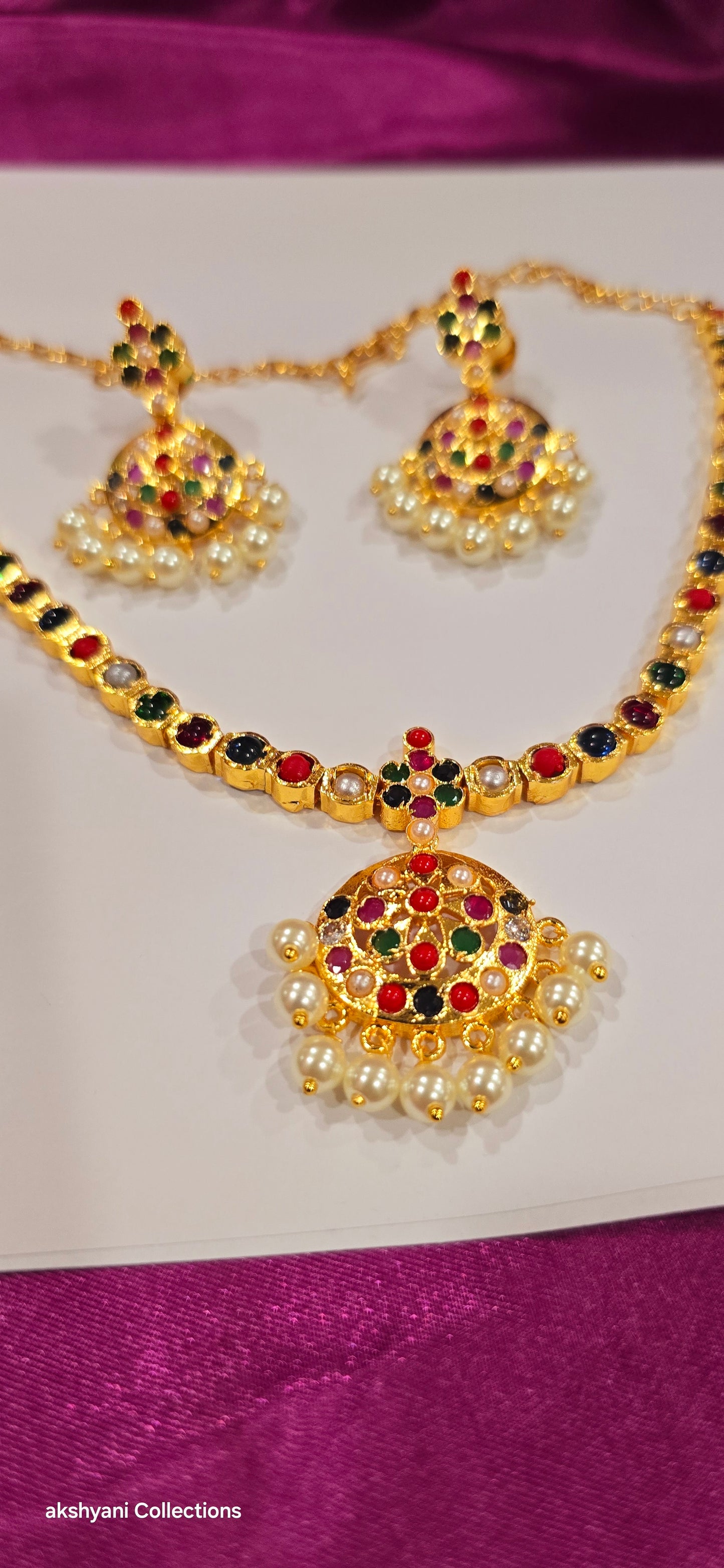 Navaratna set with earrings.  Functionwear type of jewellery.  Not 916