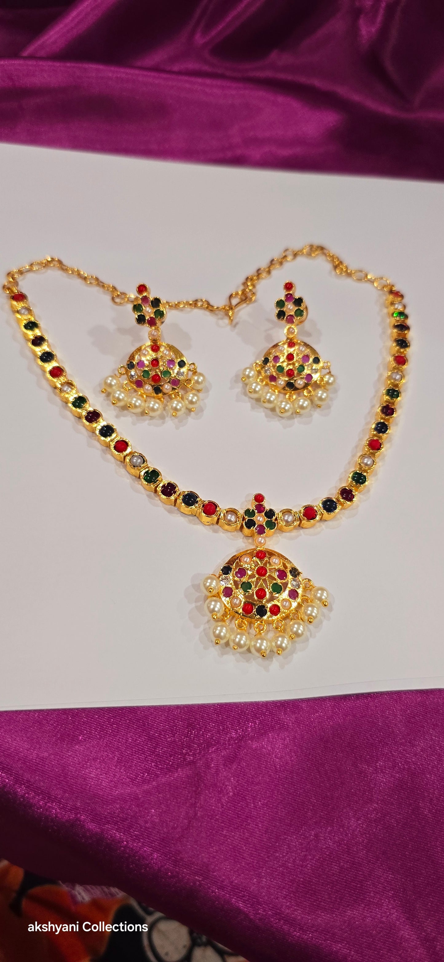 Navaratna set with earrings.  Functionwear type of jewellery.  Not 916