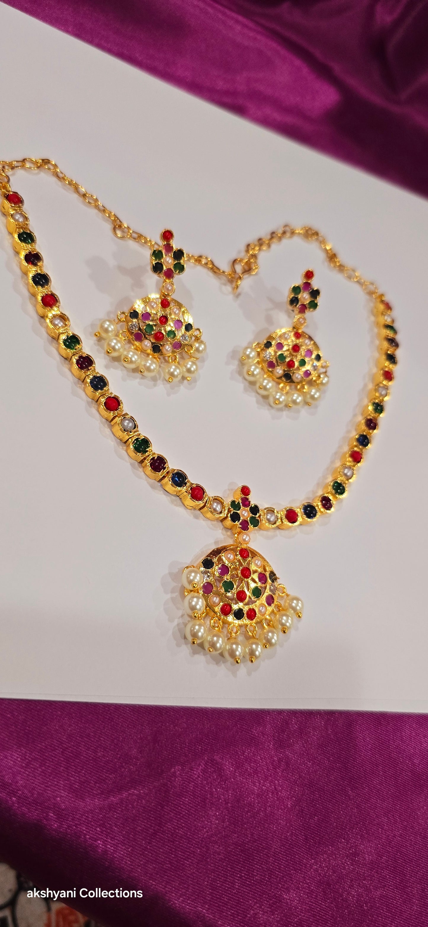 Navaratna set with earrings.  Functionwear type of jewellery.  Not 916