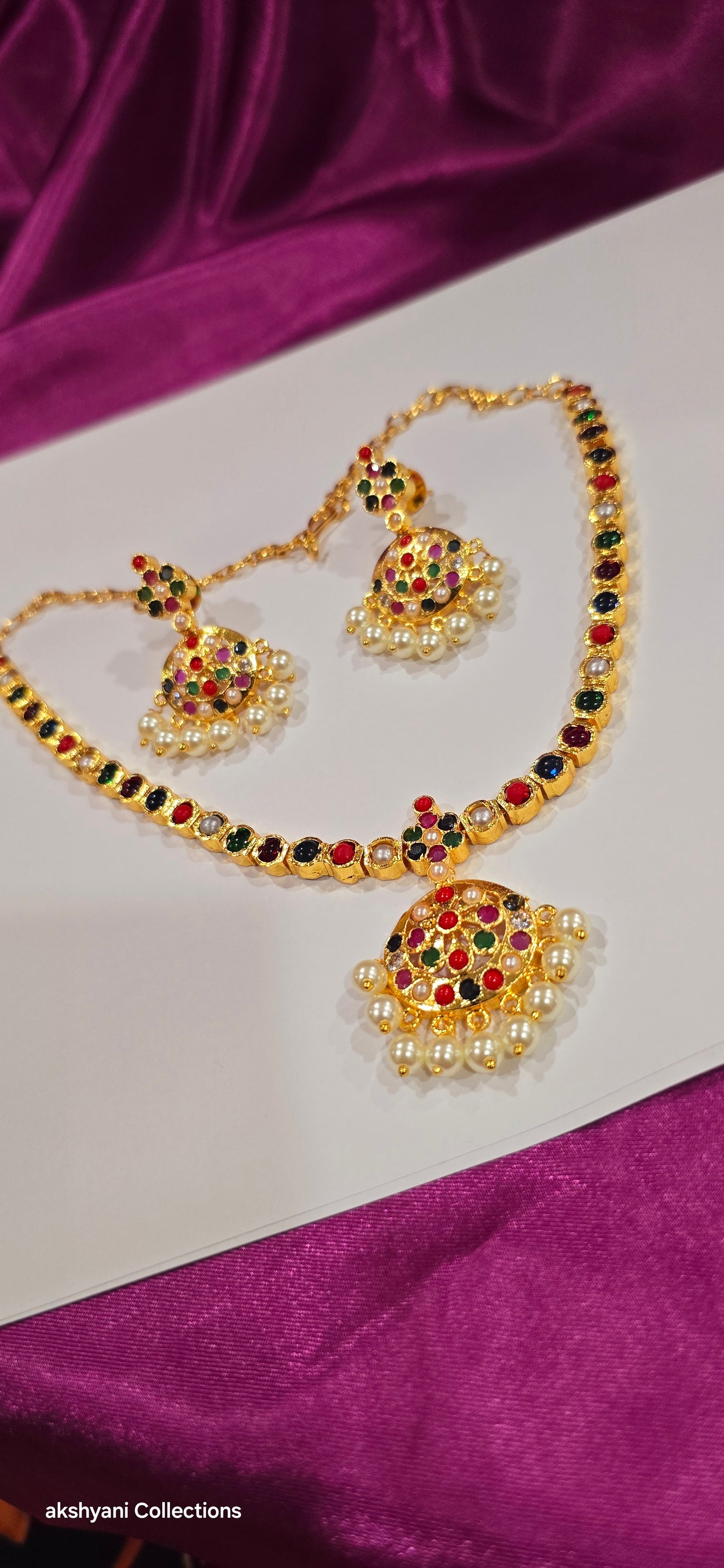 Navaratna set with earrings.  Functionwear type of jewellery.  Not 916