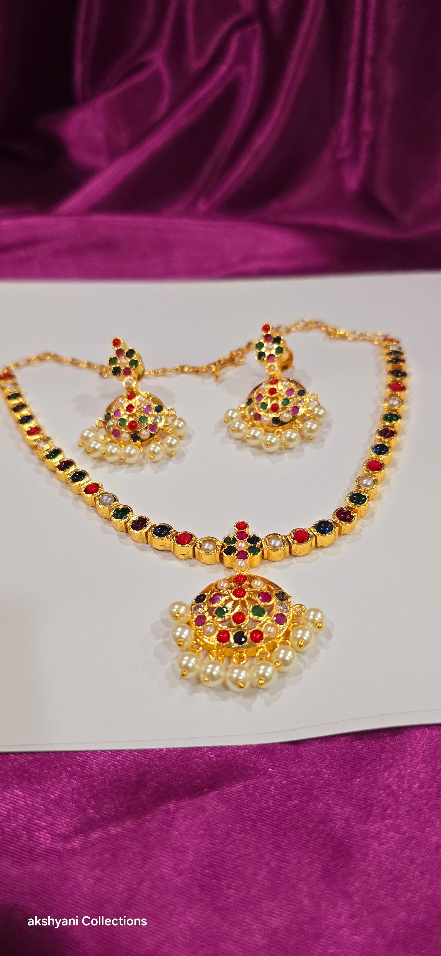 Navaratna set with earrings.  Functionwear type of jewellery.  Not 916