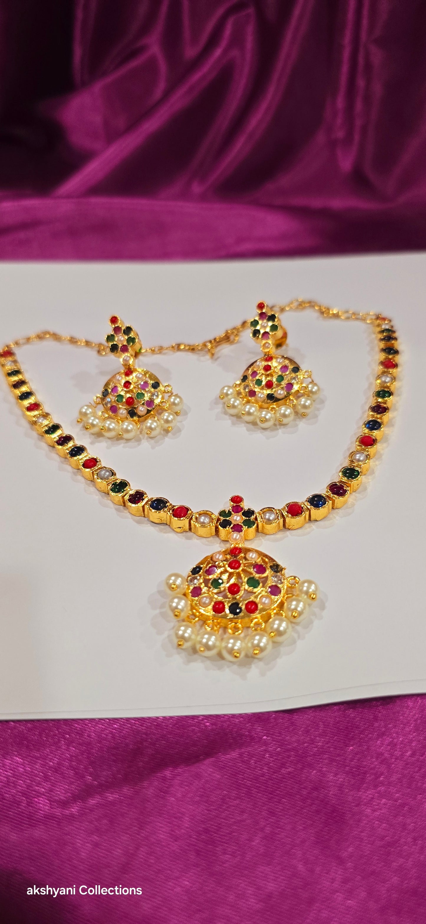 Navaratna set with earrings.  Functionwear type of jewellery.  Not 916