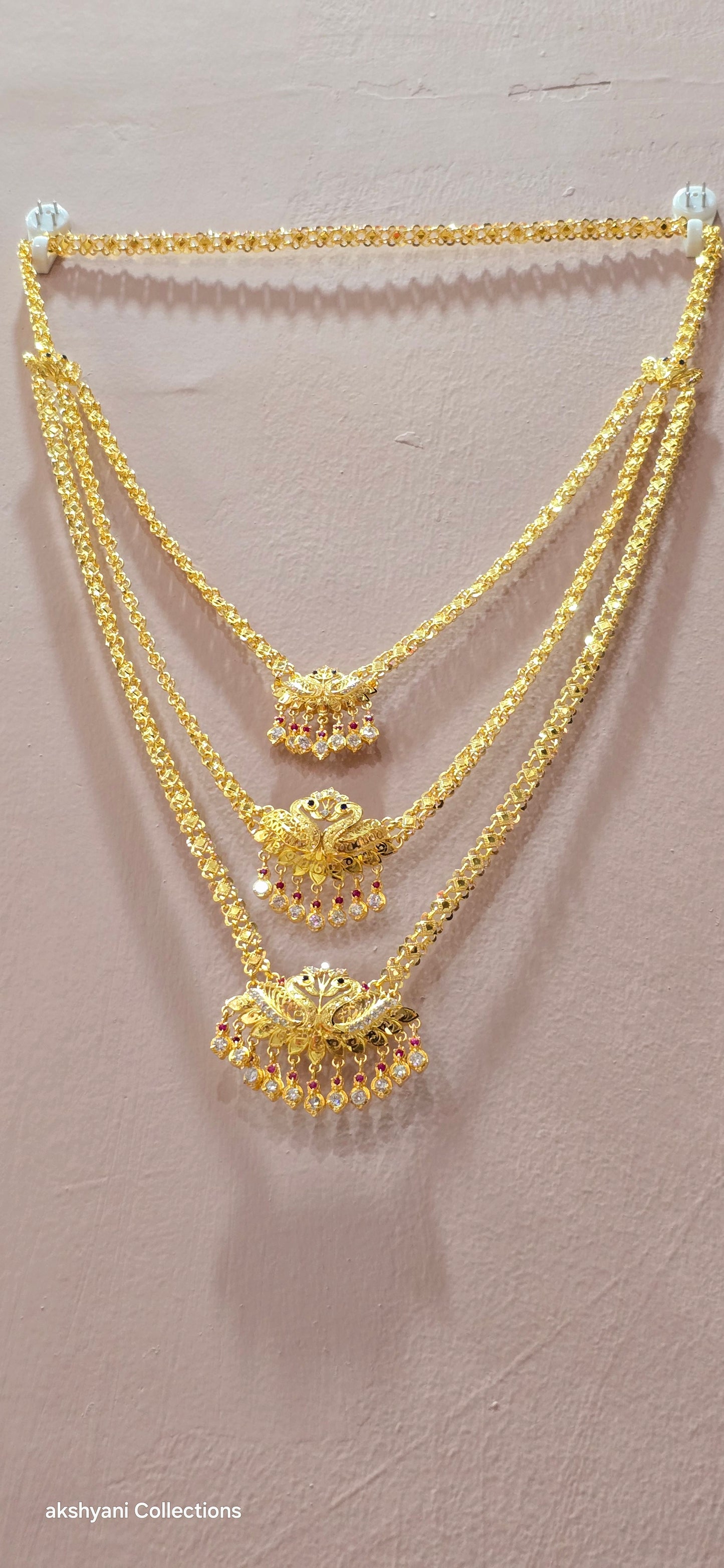 3 layer pendent chain not 916 gold. 28 inches length with decked peacock brooch. Code 808A.