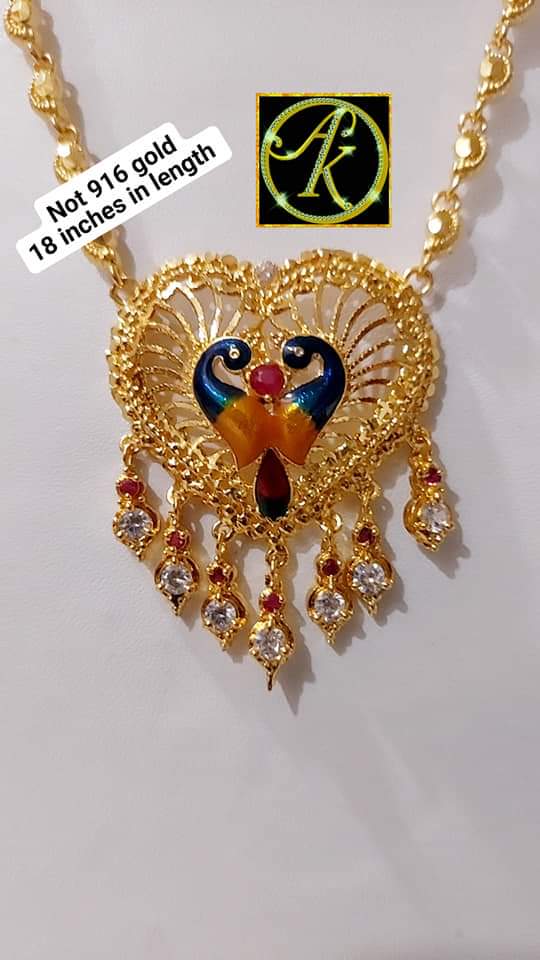 Paruppu chain with peacock locket