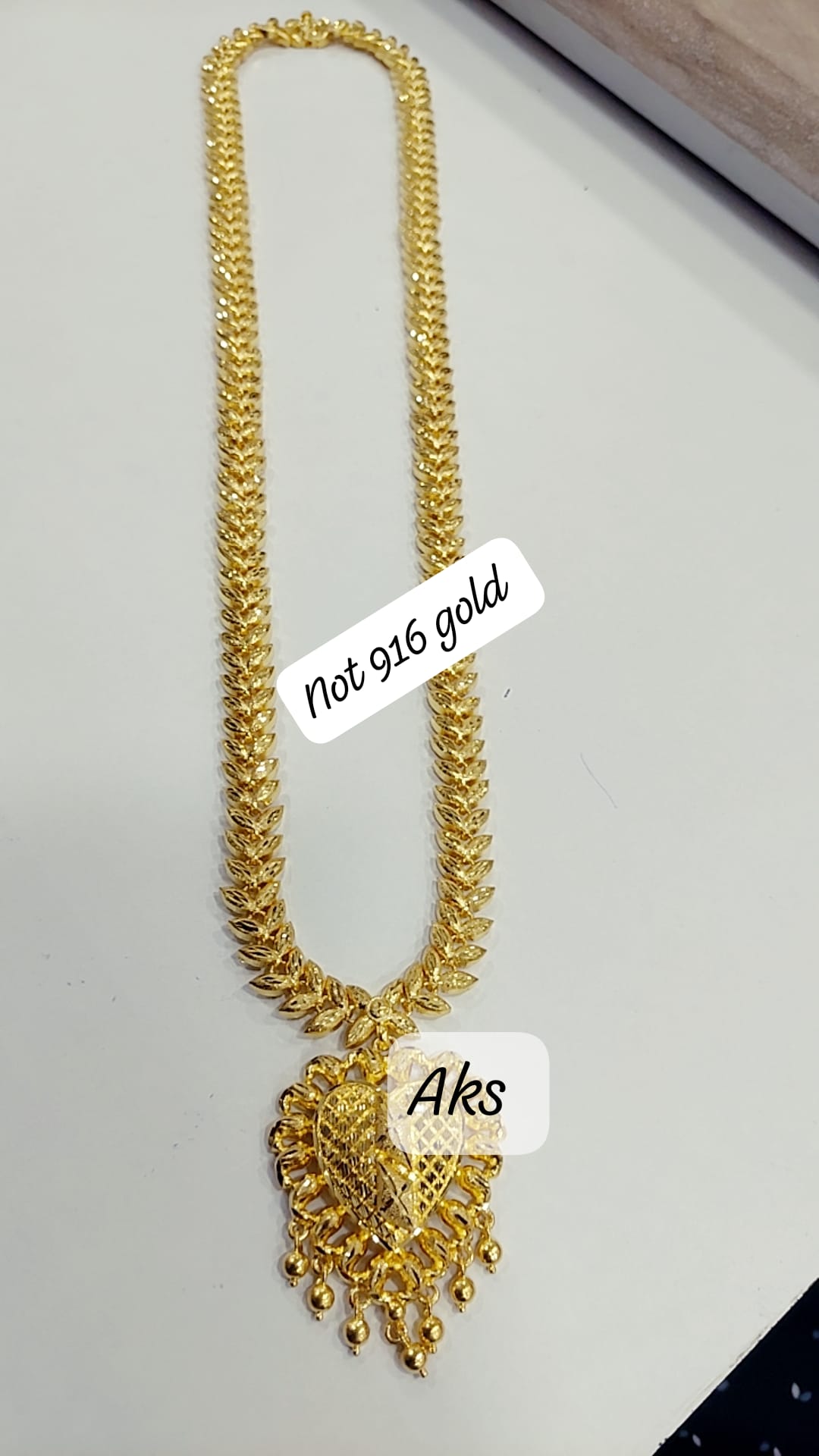 28 inches length cz designer chain with attached locket Not 916. Function wear type of jewellery. Code 09431