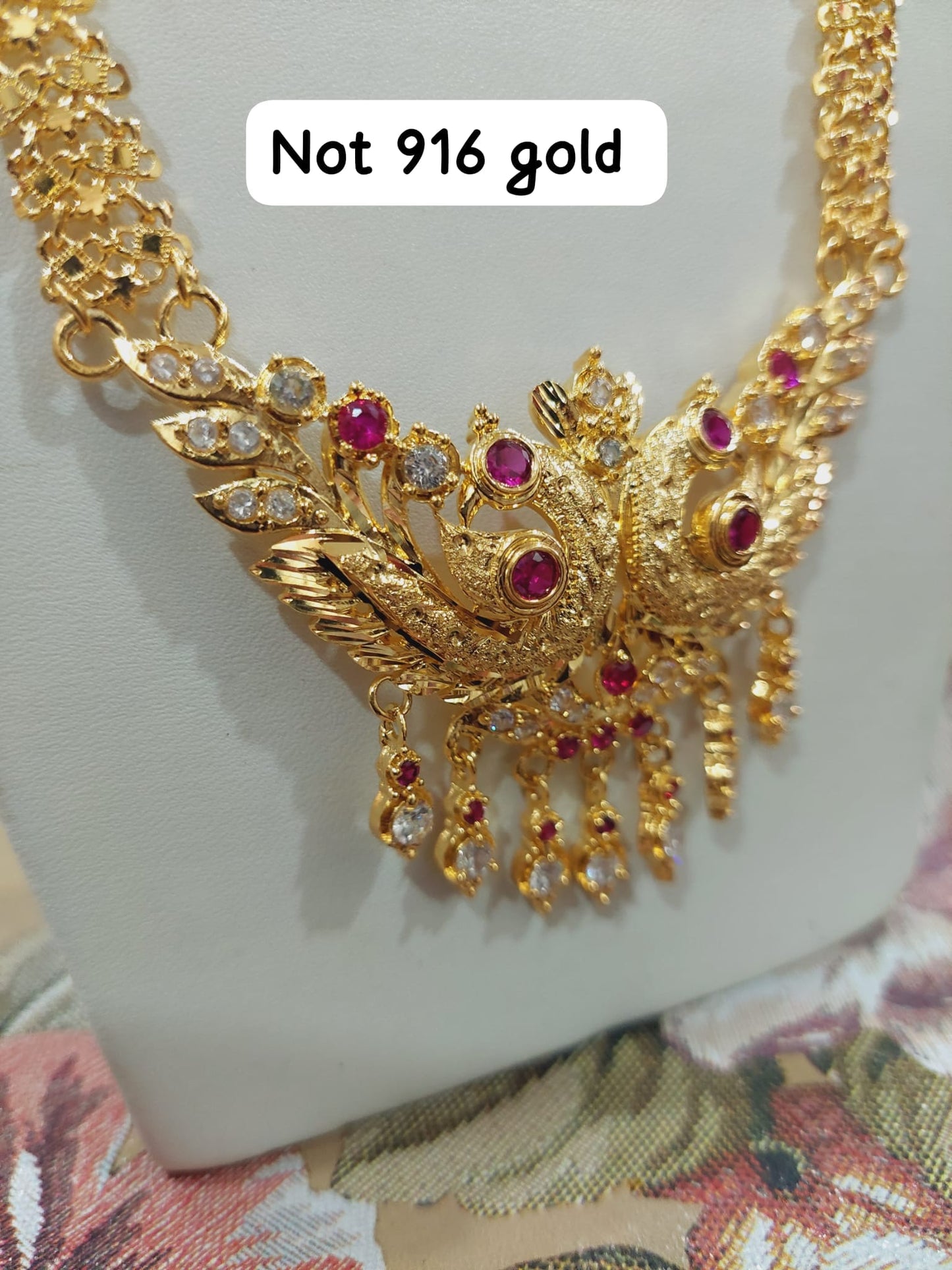 Code 333A. Peacock maalai 28 inches not 916 gold.