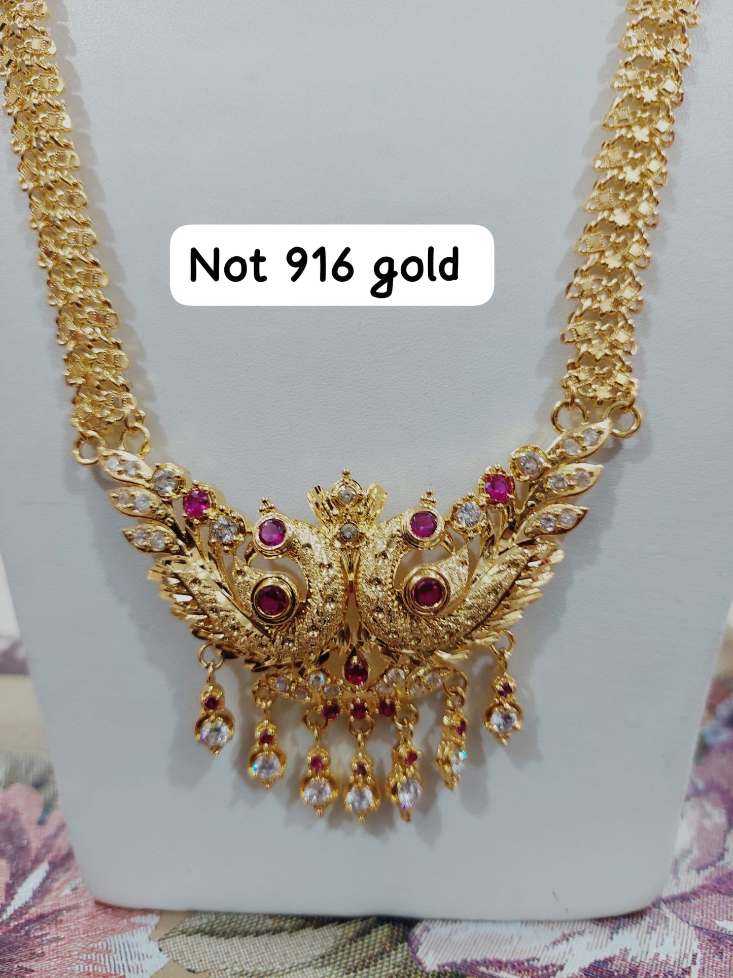 Code 333A. Peacock maalai 28 inches not 916 gold.