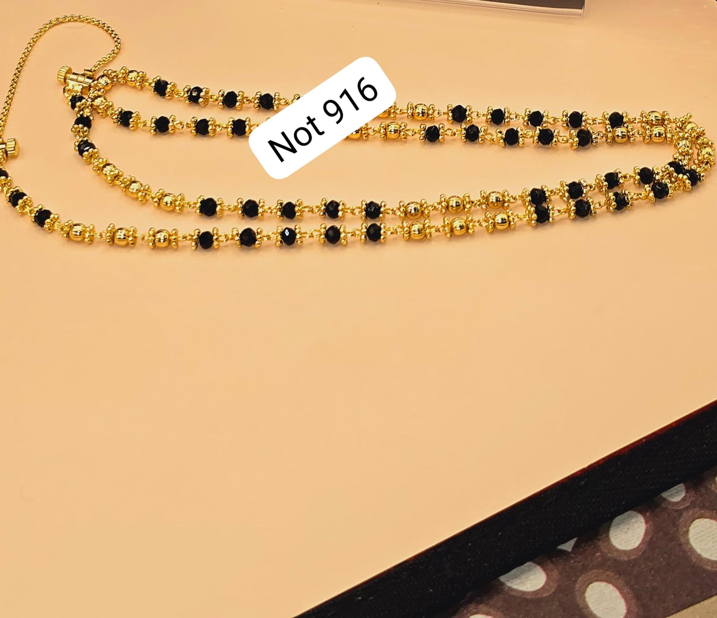 Black beads thalikodi with 3 inches extension to wear your own thali items. Not 916 gold. Function wear type