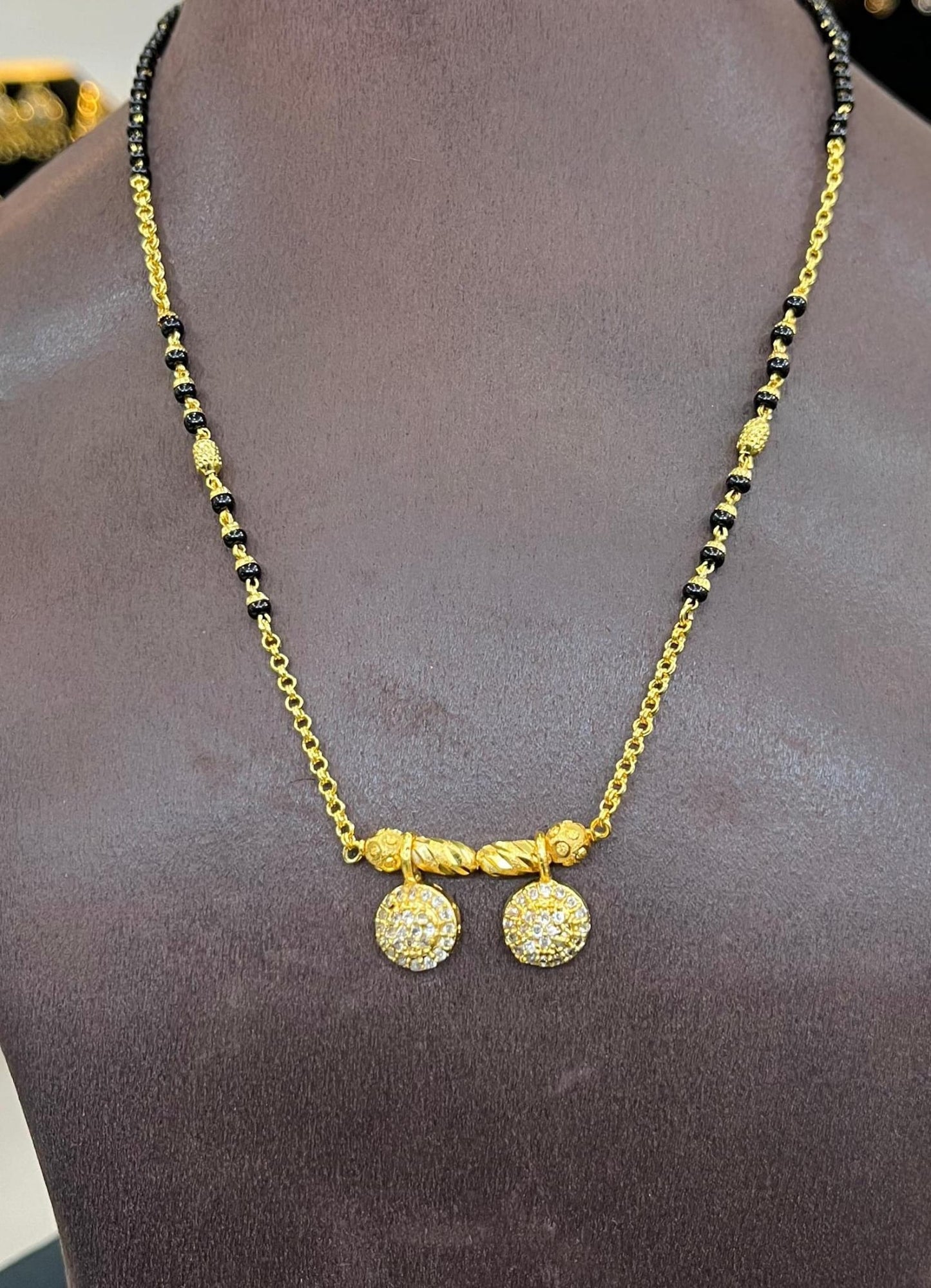 Black beads with ad locket fixed .Fashion wear type.  NOT 916 GOLD. Code 789. Length 20 inches