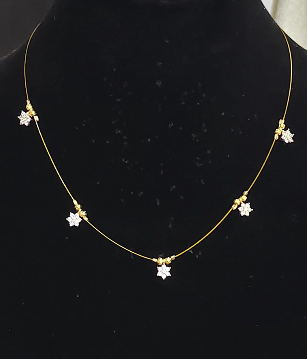 Hypoallergenic jewellery. Star cut  mossanite locket with gold wire. Code 777U