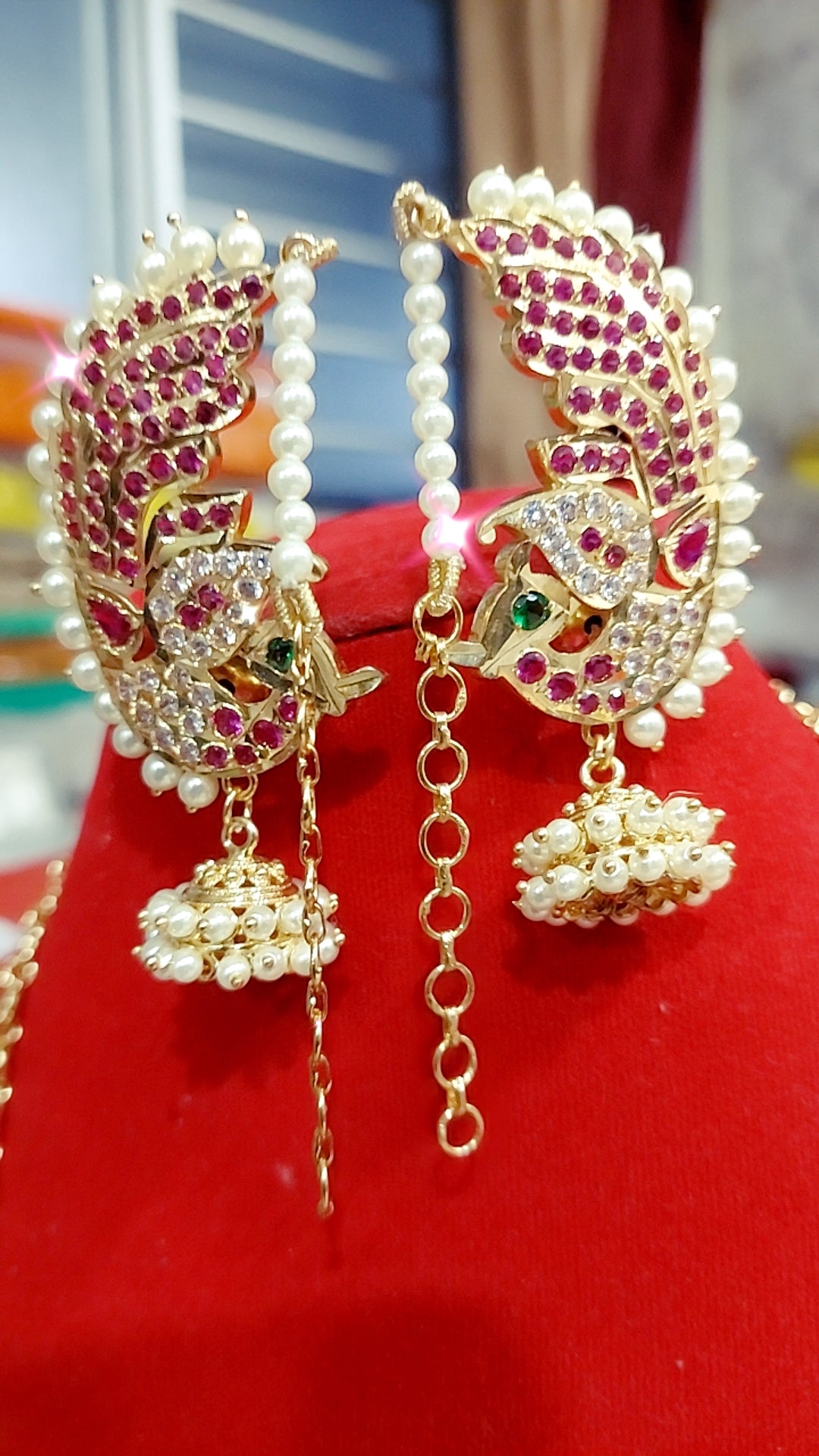 Peacock pearl earrings with attached mattal